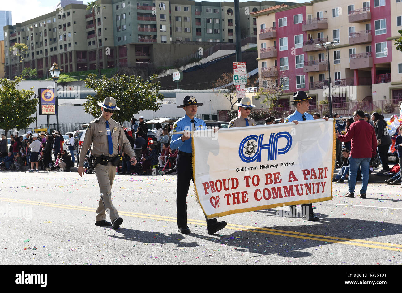 LOS ANGELES - FEBRUARY 9, 2019: California Highway Patrol Officers and Banner at the Los Angeles Chinese New Year Parade. Stock Photo