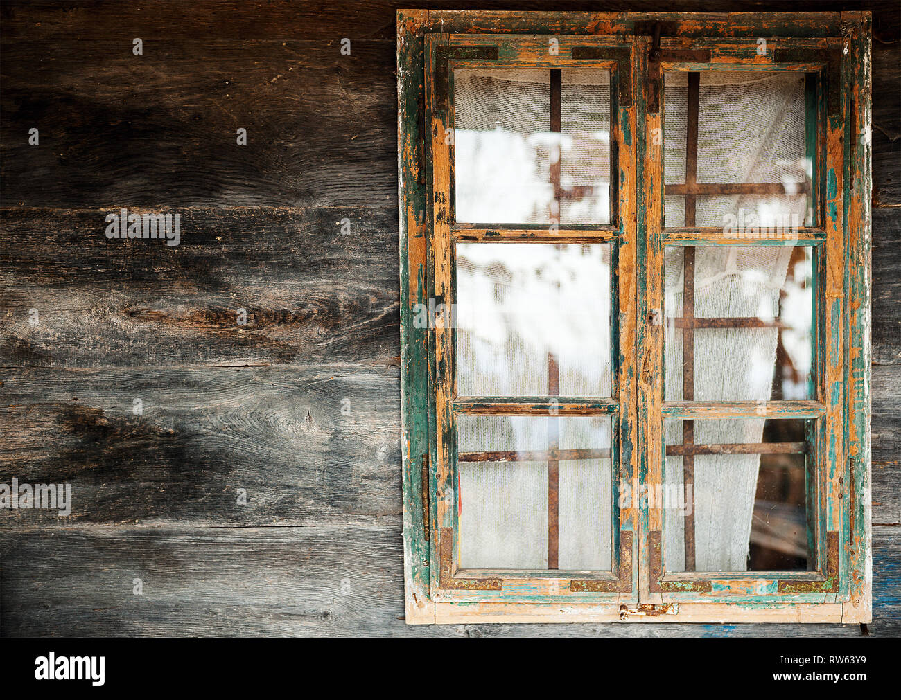Abstract of an old wooden house, closeup view on wooden window frame and wall. Stock Photo