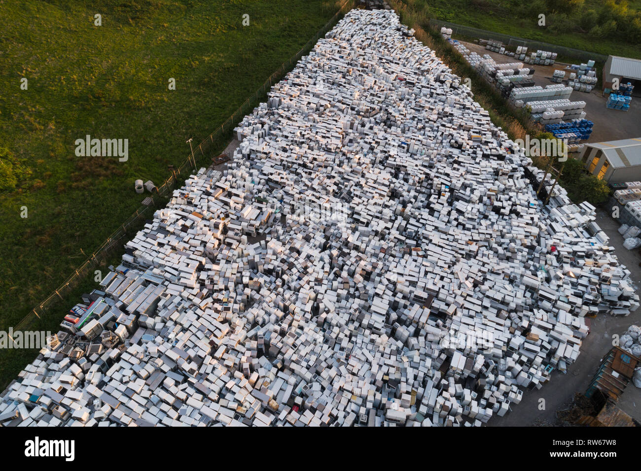 Aerial image of a fridge recycling and disposal yard in Perth, Scotland, showing thousands of used refrigerators in stacks. Stock Photo