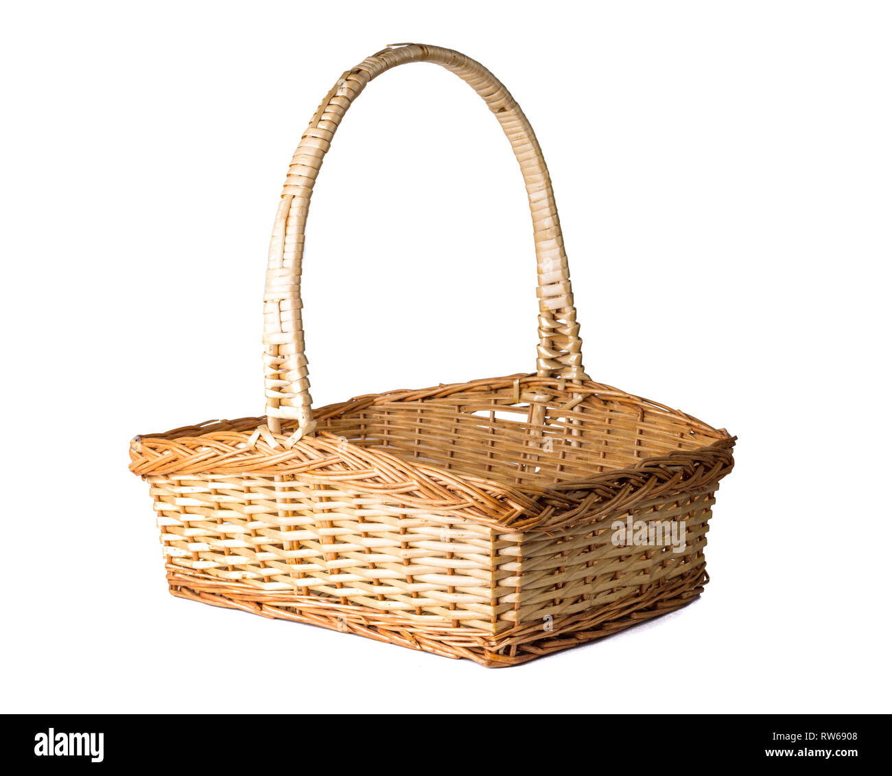 Wicker woven Easter basket isolated on white Stock Photo