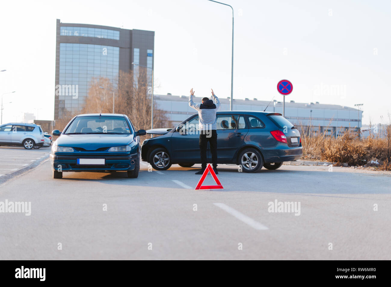 Adult upset driver man in front of automobile crash car collision