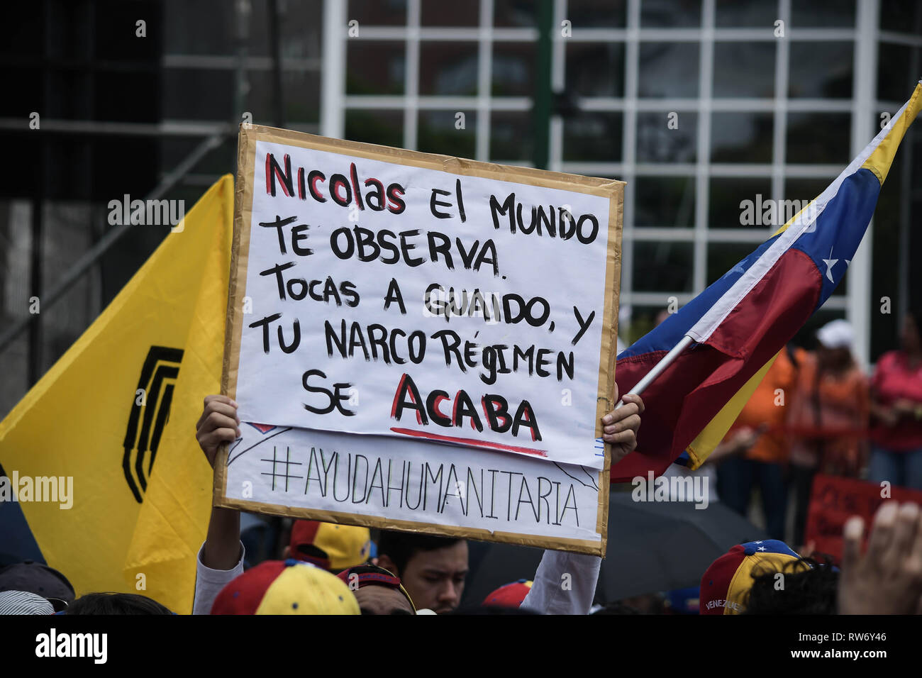 A man seen holding a placard during a rally in support of Juan Guaido. Juan Guaido, the Venezuelan opposition leader, where many nations have recognized as the legitimate interim president of Venezuela, greets his supporters during a rally against the government of President Nicolas Maduro in Caracas. Stock Photo