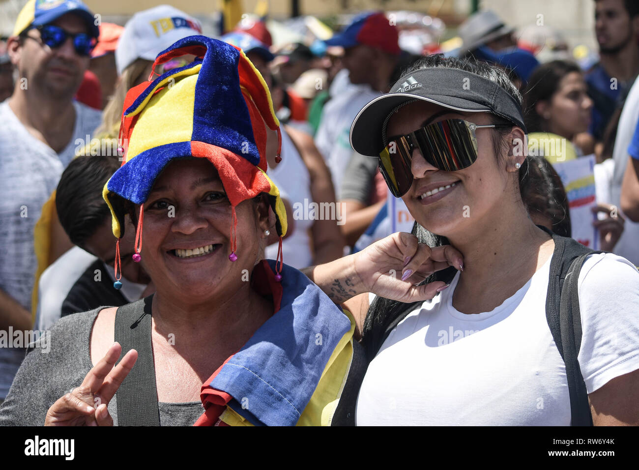 Two female supporters of interim president Juan Guaido are seen during a rally in support of Juan Guaido. Juan Guaido, the Venezuelan opposition leader, where many nations have recognized as the legitimate interim president of Venezuela, greets his supporters during a rally against the government of President Nicolas Maduro in Caracas. Stock Photo