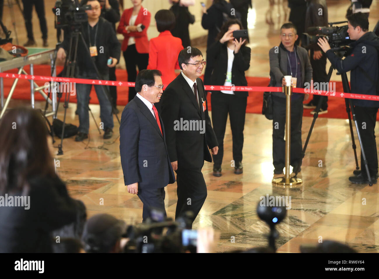Beijing, China. 5th Mar, 2019. Chen Gang (R, front) and Li Dongsheng, deputies to the 13th National People's Congress (NPC), prepare to receive an interview before the opening meeting of the second session of the 13th NPC in Beijing, capital of China, March 5, 2019. Credit: Jin Liwang/Xinhua/Alamy Live News Stock Photo