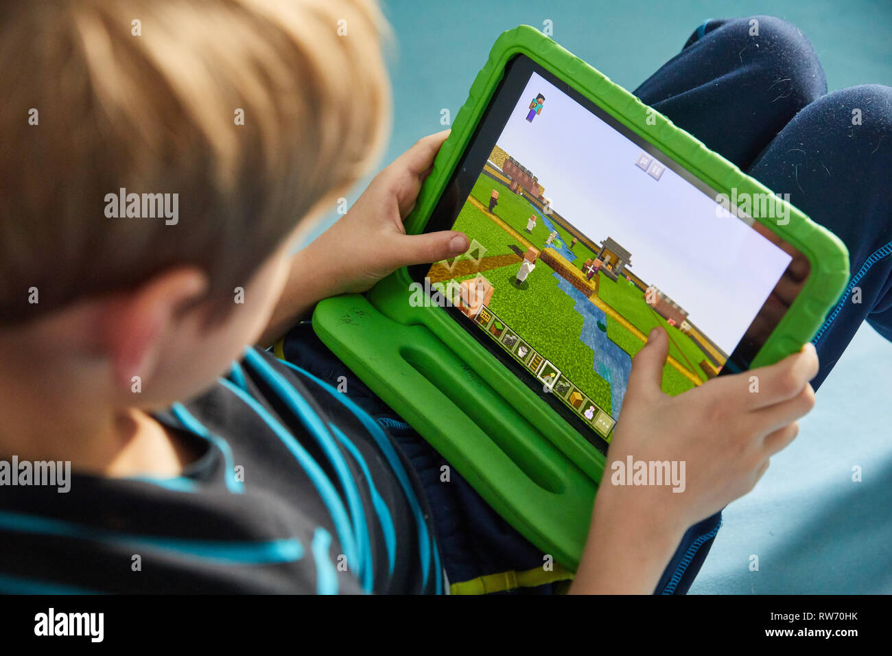 Teenager playing Minecraft multiplayer online game (MMO Stock Photo - Alamy