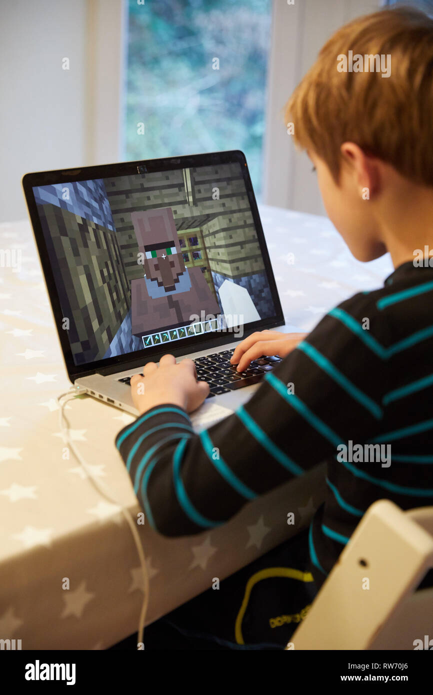 Teenager playing Minecraft multiplayer online game (MMO Stock Photo - Alamy