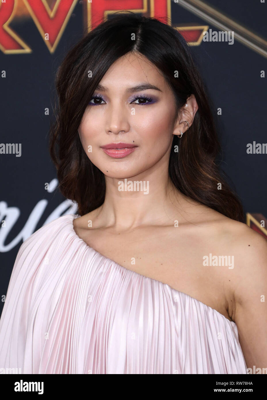 HOLLYWOOD, LOS ANGELES, CA, USA - MARCH 04: Actress Gemma Chan wearing Ralph and Russo arrives at the Los Angeles Premiere Of Marvel Studios 'Captain Marvel' held at the El Capitan Theatre on March 4, 2019 in Hollywood, Los Angeles, California, United States. (Photo by David Acosta/Image Press Agency) Stock Photo
