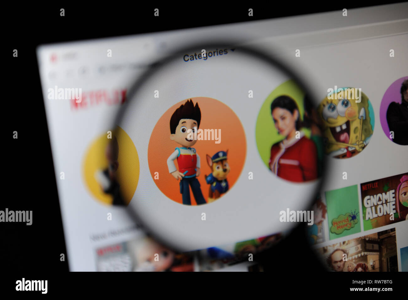 Childrens TV shows seen through a magnifying glass on Netflix Stock Photo