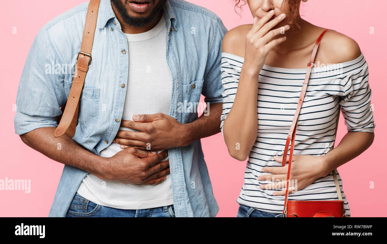 Tourists Suffering From Food Poisoning Having Stomach Ache Stock Photo
