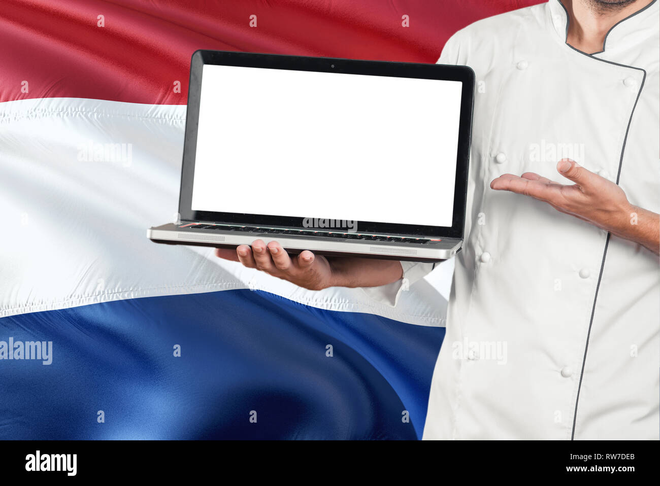 Dutch Chef holding laptop with blank screen on Netherlands flag