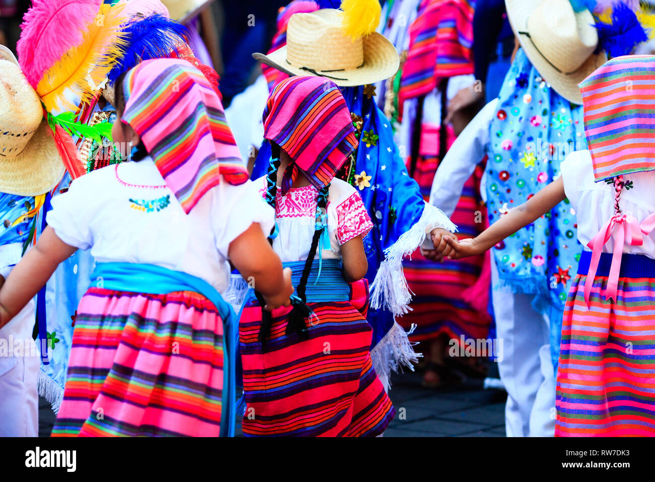 A group of mexican children dressed with traditional mexican colorful costumes Stock Photo