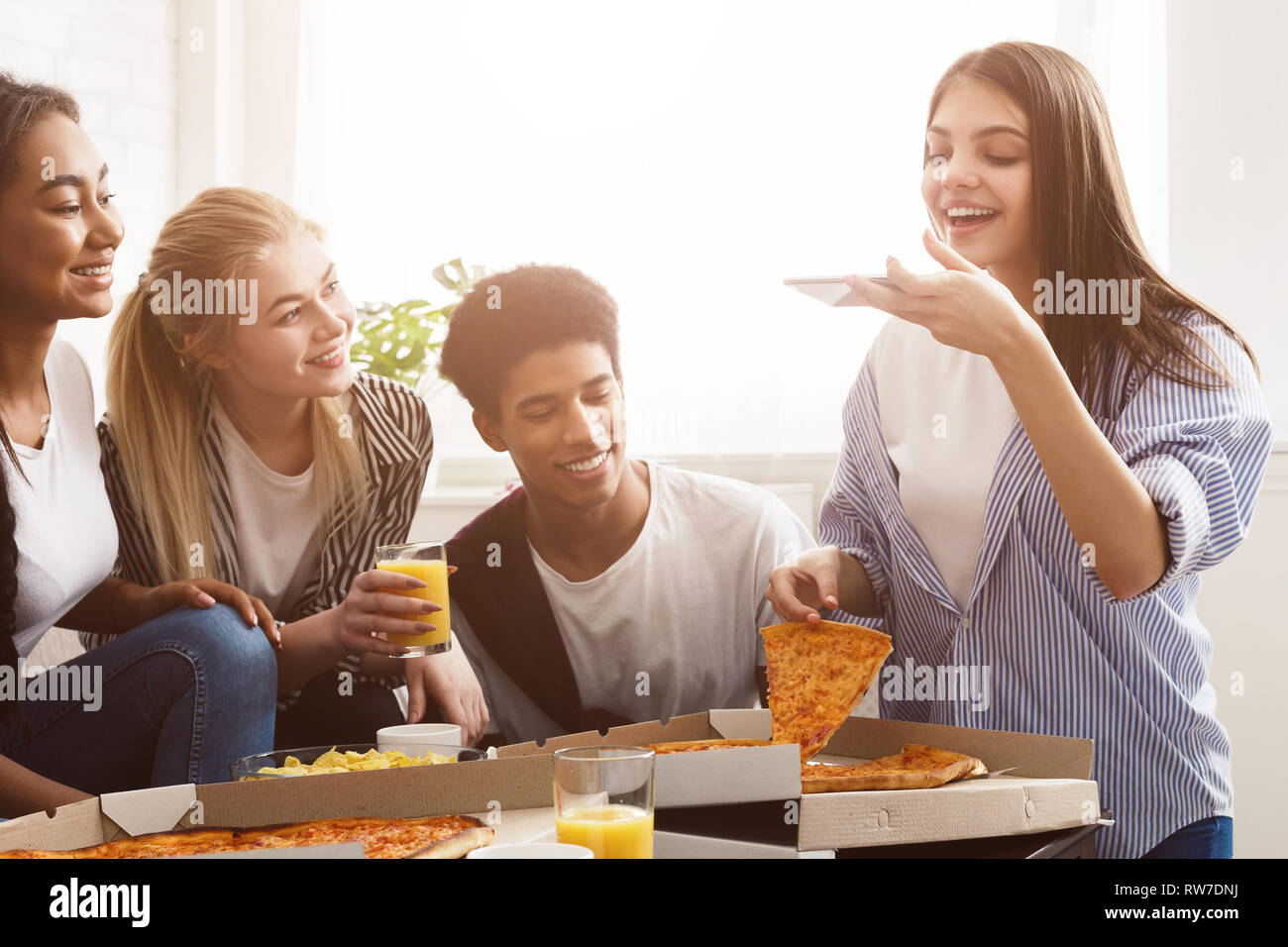 Girl Taking Photo Of Pizza Spending Time With Friends Stock Photo Alamy
