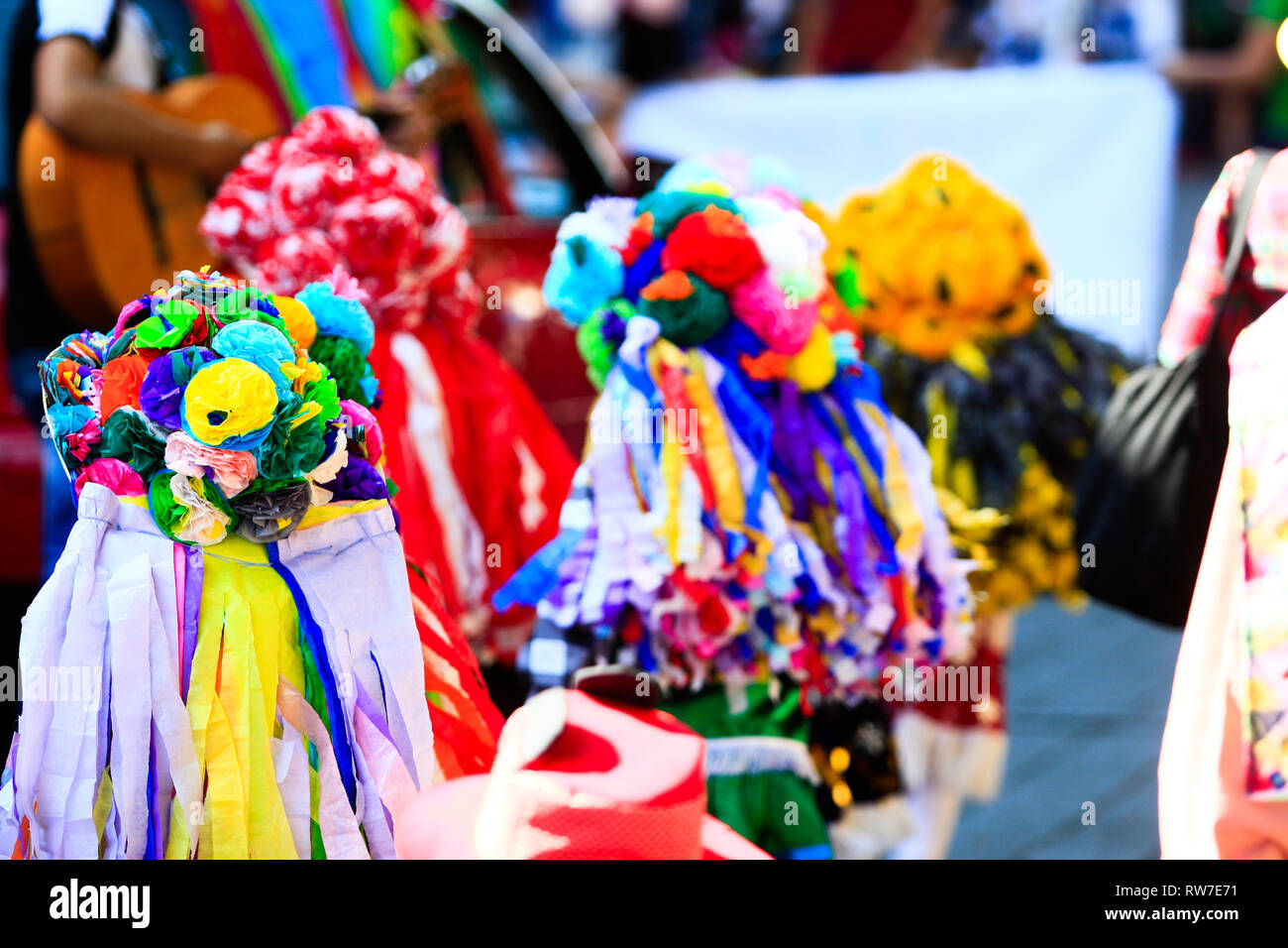 A group of mexican children dressed with traditional mexican colorful hats during carnival Stock Photo