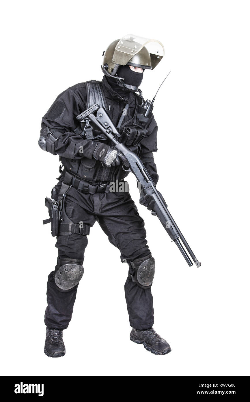 Spec ops soldier in black uniform and face mask with shotgun Stock Photo -  Alamy