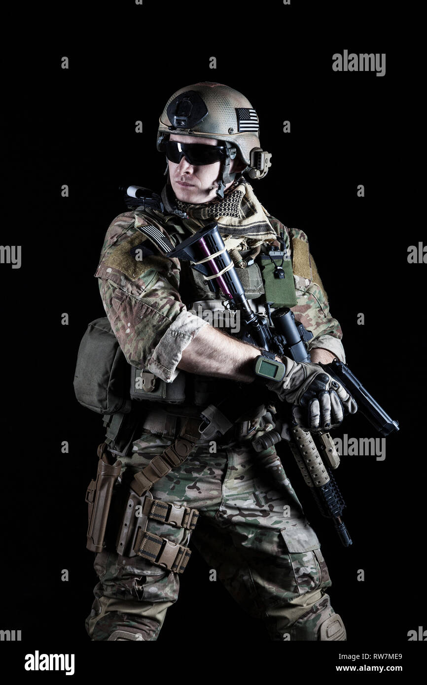 United States Army ranger with pistol on dark background Stock Photo