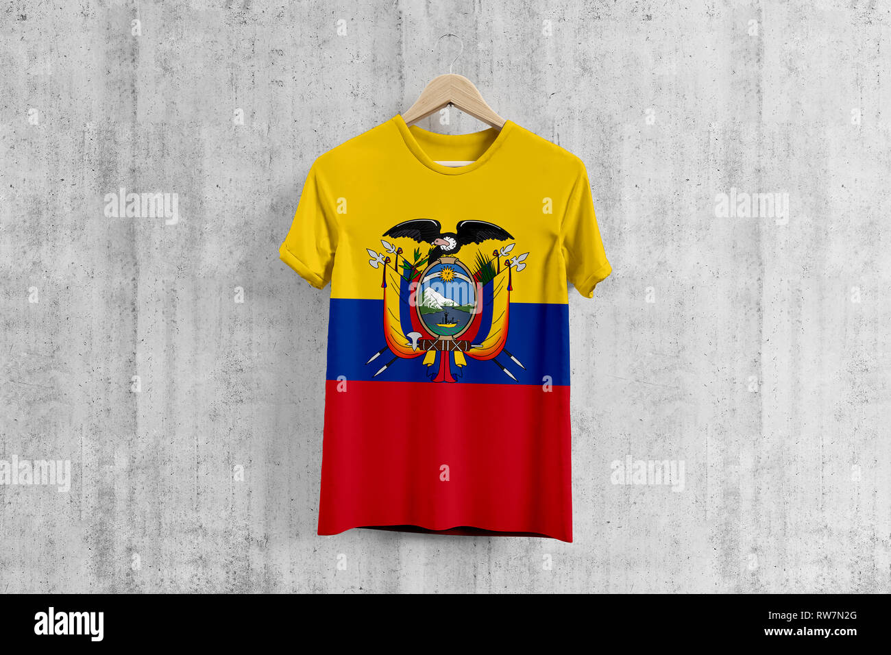 Ecuador flag T-shirt on hanger, Ecuadorean team uniform design idea for garment production. National wear. 3D Rendering. Stock Photo