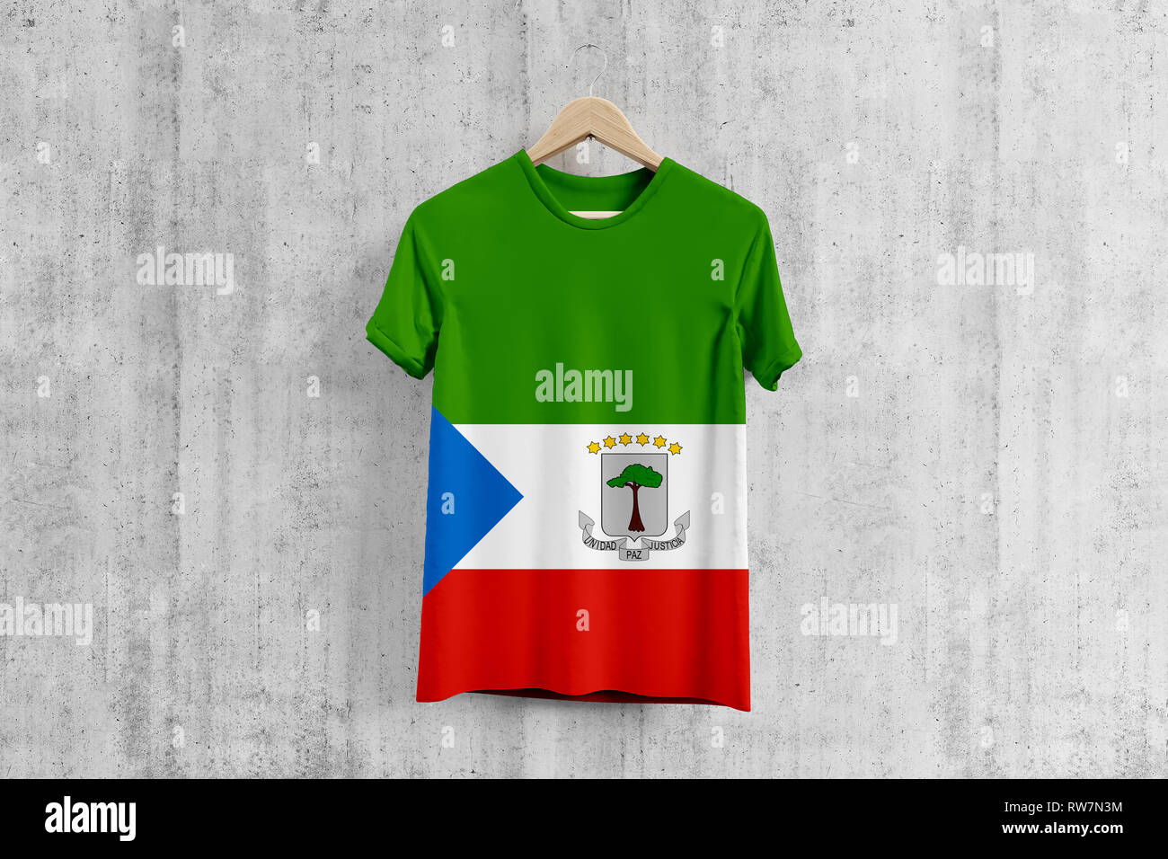 Equatorial Guinea flag T-shirt on hanger, team uniform design idea for garment production. National wear. 3D Rendering. Stock Photo