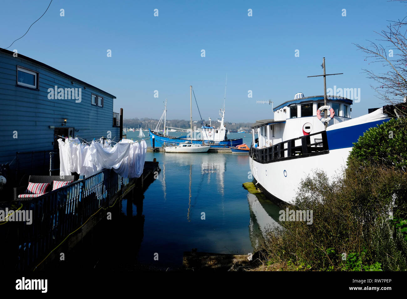 View from the road of houseboats at high tide moored in Bembridge