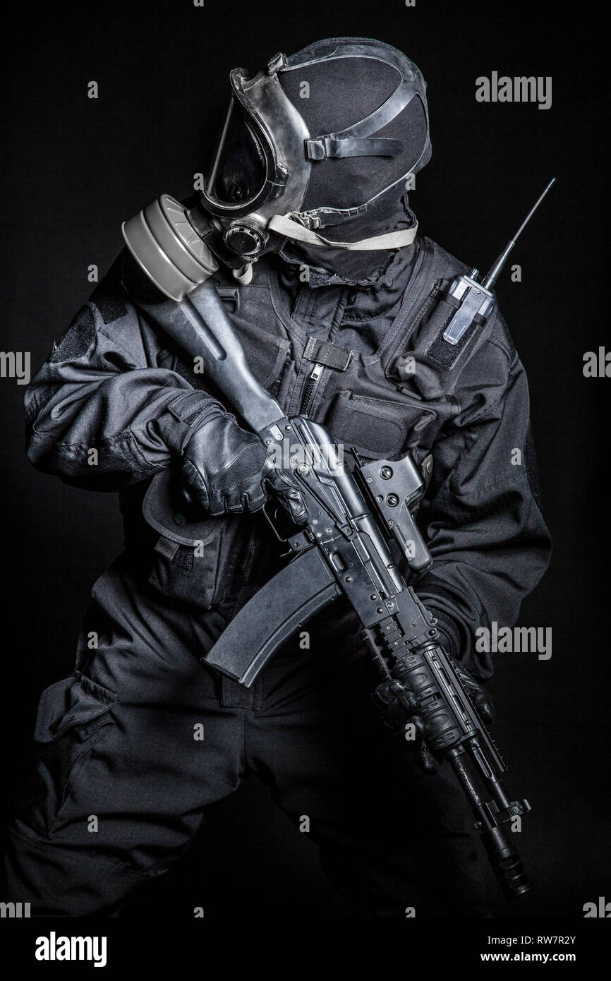 Russian special forces operator in black uniform and gas mask Stock Photo -  Alamy
