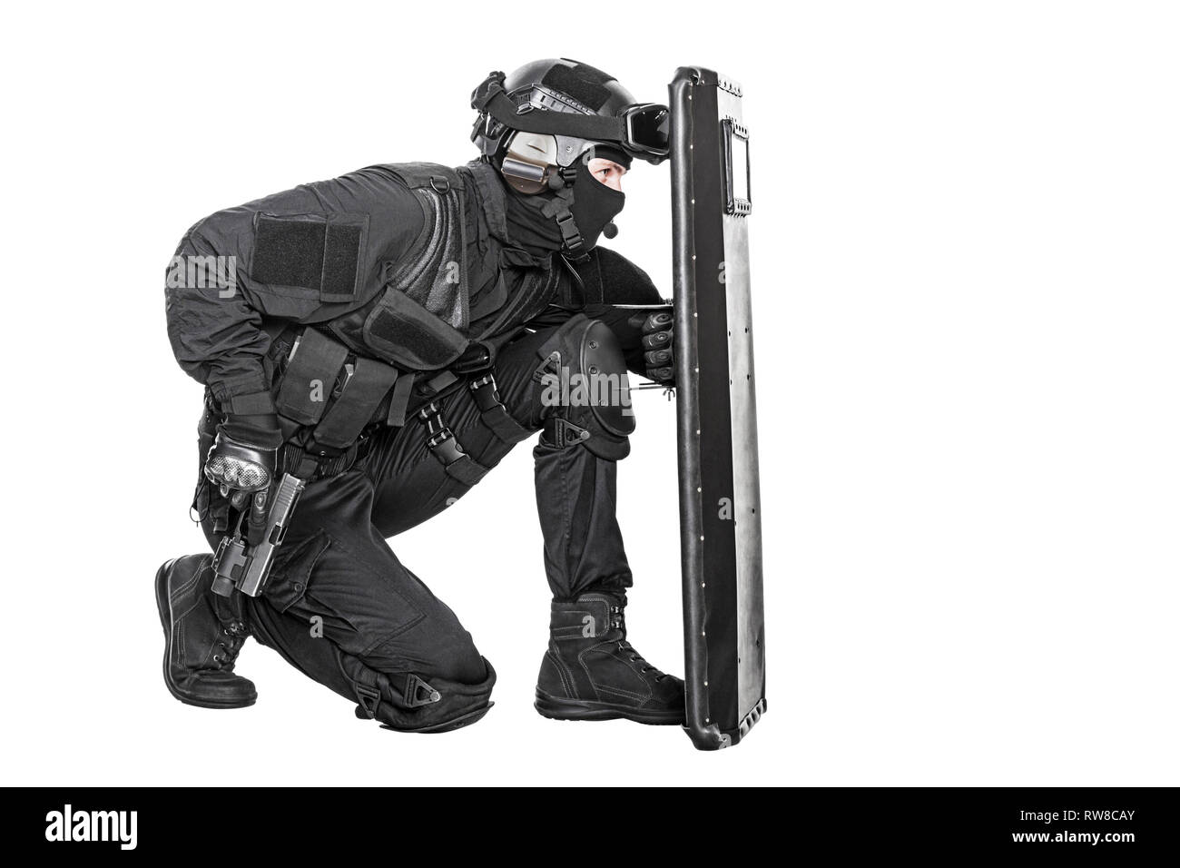 https://c8.alamy.com/comp/RW8CAY/studio-shot-of-swat-police-special-forces-with-pistol-hiding-behind-ballistic-shield-RW8CAY.jpg