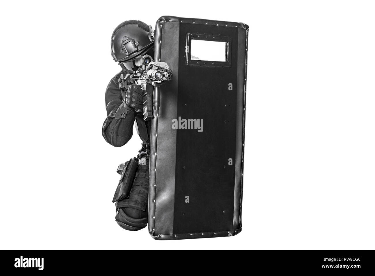 Studio shot of SWAT police special forces with pistol hiding