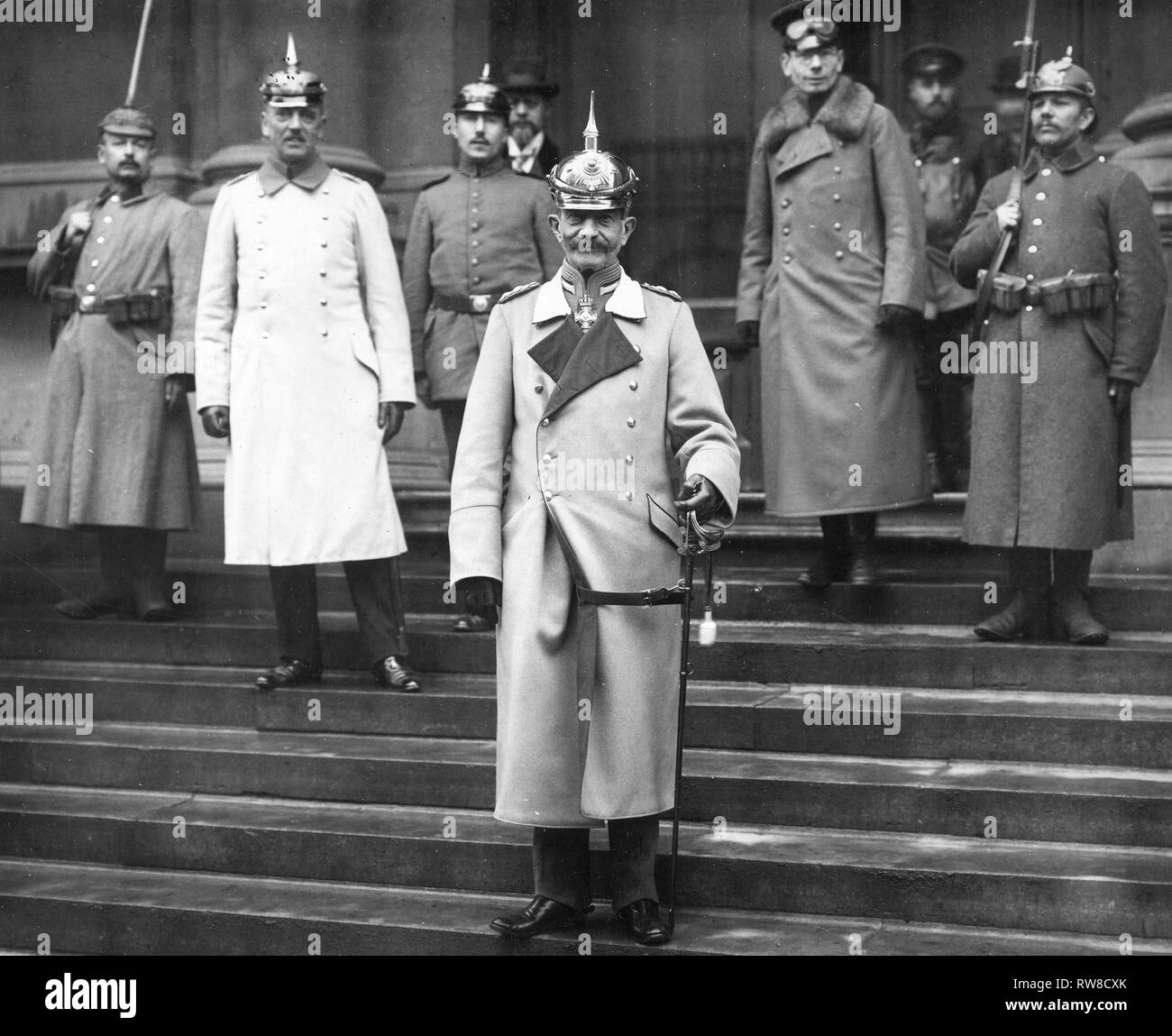 German propaganda activities. Von Bissing, Governor General of Belgium, receiving the correspondents -- the military officer who accompanies the correspondents with auto goggles on his cap ca. 1918 Stock Photo