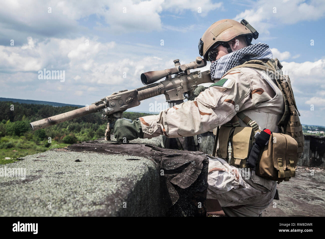 Member of Navy SEAL Team with weapons in action Stock Photo