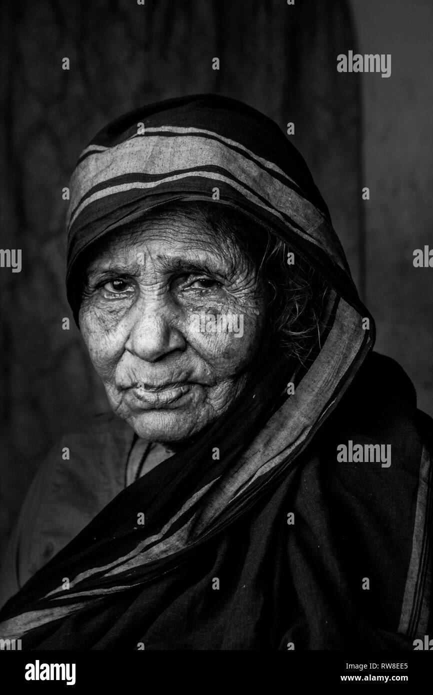 This photo was taken in slum. She is 90+ years old women live her combined  family. Stock Photo