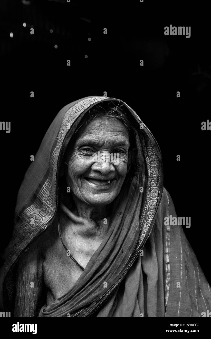 This photo was taken in slum. He is 90+ years old women live her combined  family. Stock Photo