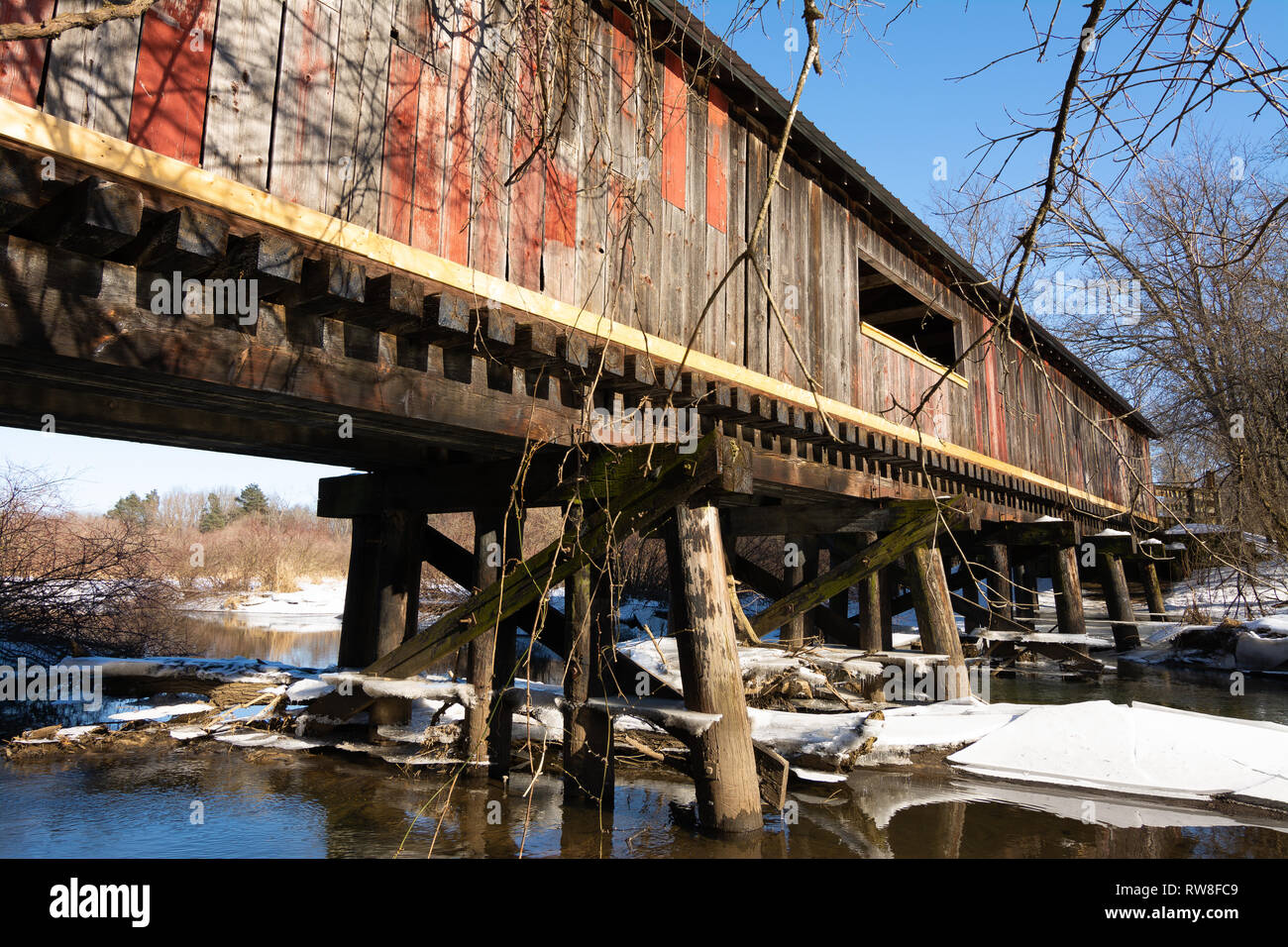 Covered bridge over Sugar Creek in Decatur, Wisconsin, USA Stock Photo