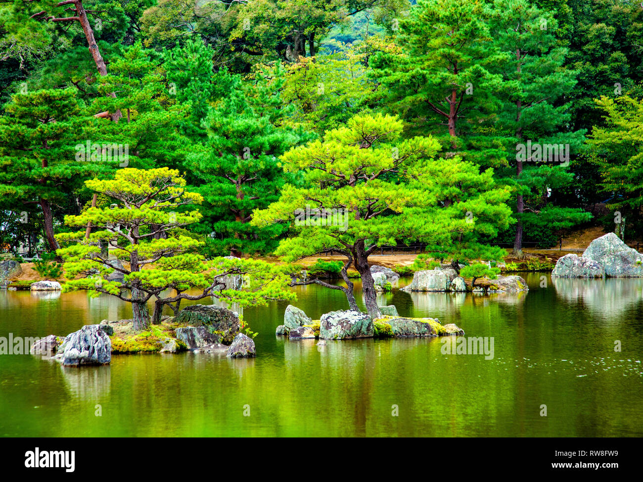 Magnificent historic gardens at Kyoto in Japan with reflections in lake Stock Photo