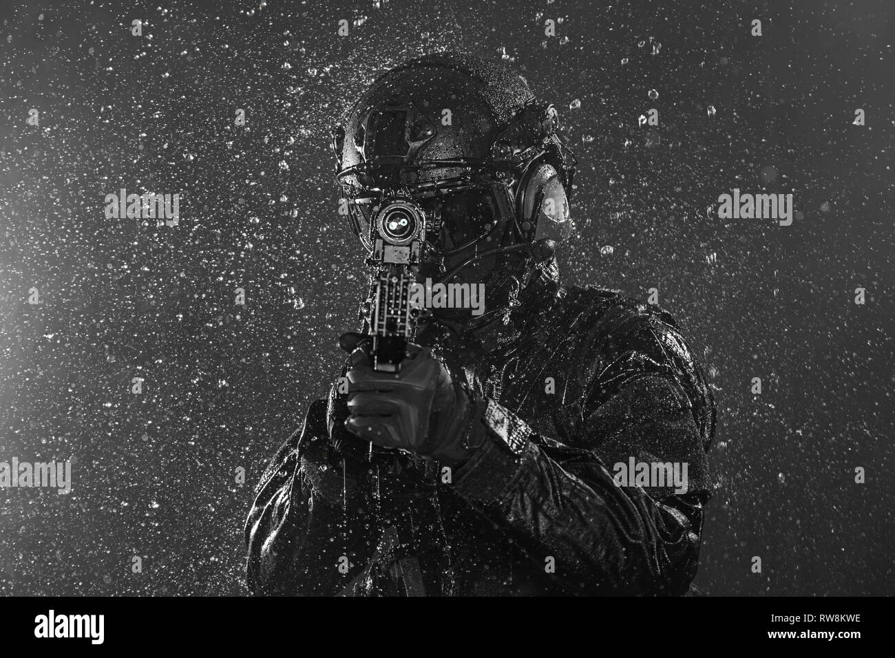 Spec ops police officer SWAT in the rain. Stock Photo