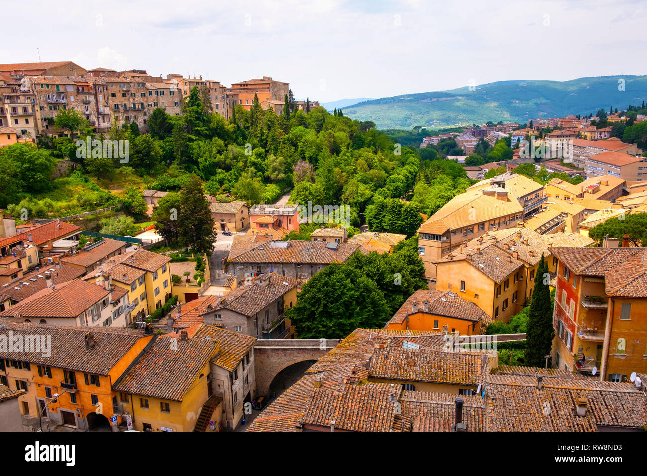Perugia, Umbria / Italy - 2018/05/28: Panoramic view of historic aqueduct forming Via dell Acquedotto pedestrian street along the ancient Via Appia Stock Photo