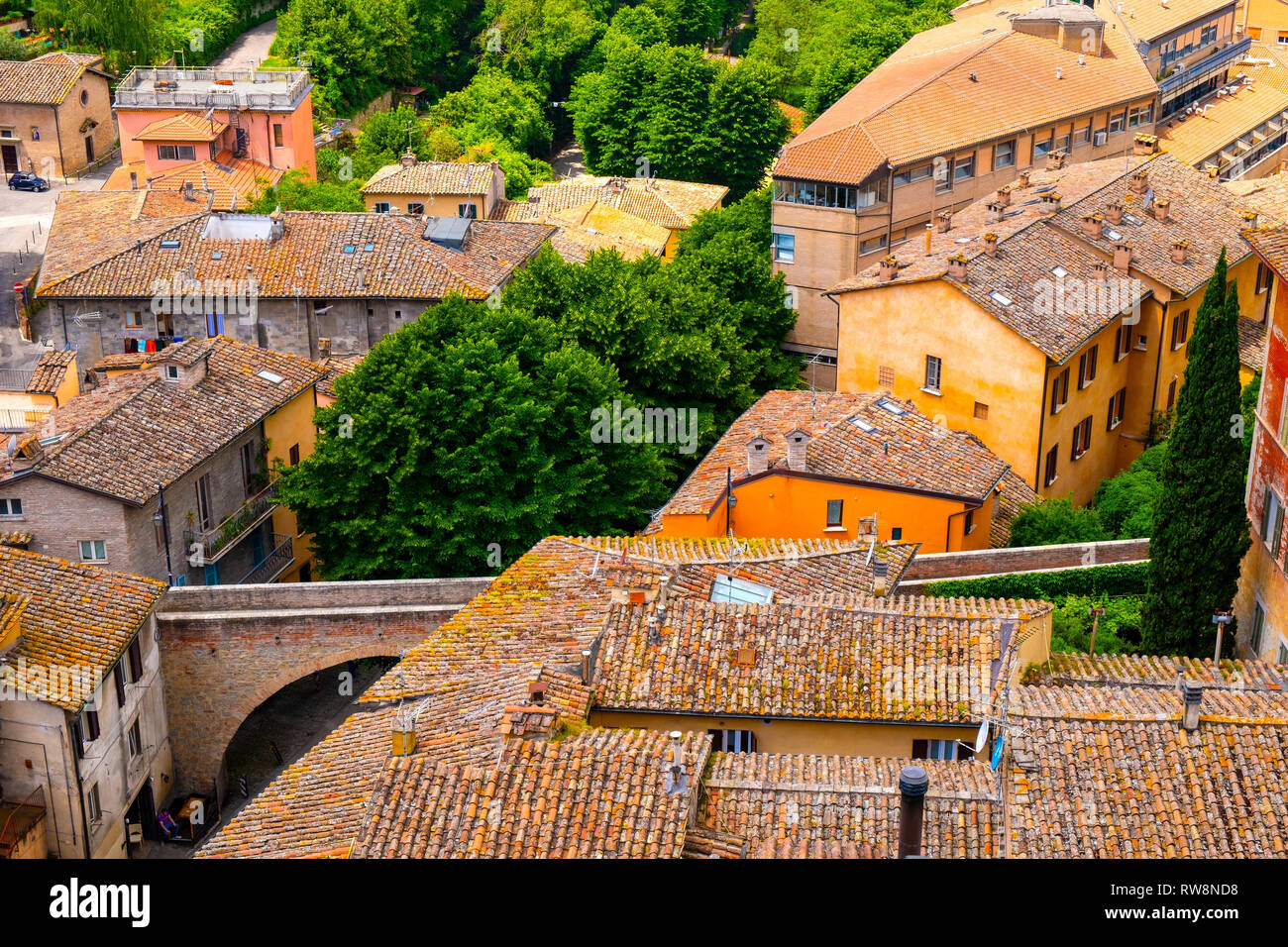 Perugia, Umbria / Italy - 2018/05/28: Panoramic view of historic aqueduct forming Via dell Acquedotto pedestrian street along the ancient Via Appia Stock Photo