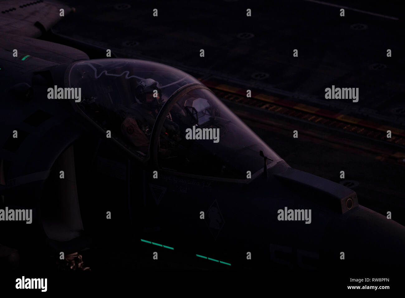 An AV-8B Harrier with the 22nd Marine Expeditionary Unit taxis down the flight deck prior to take off aboard the Wasp-class amphibious assault ship USS Kearsarge (LHD-3). The Harriers, with Marine Medium Tiltrotor Squadron 264 (Reinforced), carry out daily routine flights in order to maintain operational readiness. Marines and Sailors with the 22nd MEU and Kearsarge Amphibious Ready Group are currently deployed to the U.S. 5th Fleet area of operations in support of naval operations to ensure maritime stability and security in the Central region, connecting the Mediterranean and the Pacific thr Stock Photo