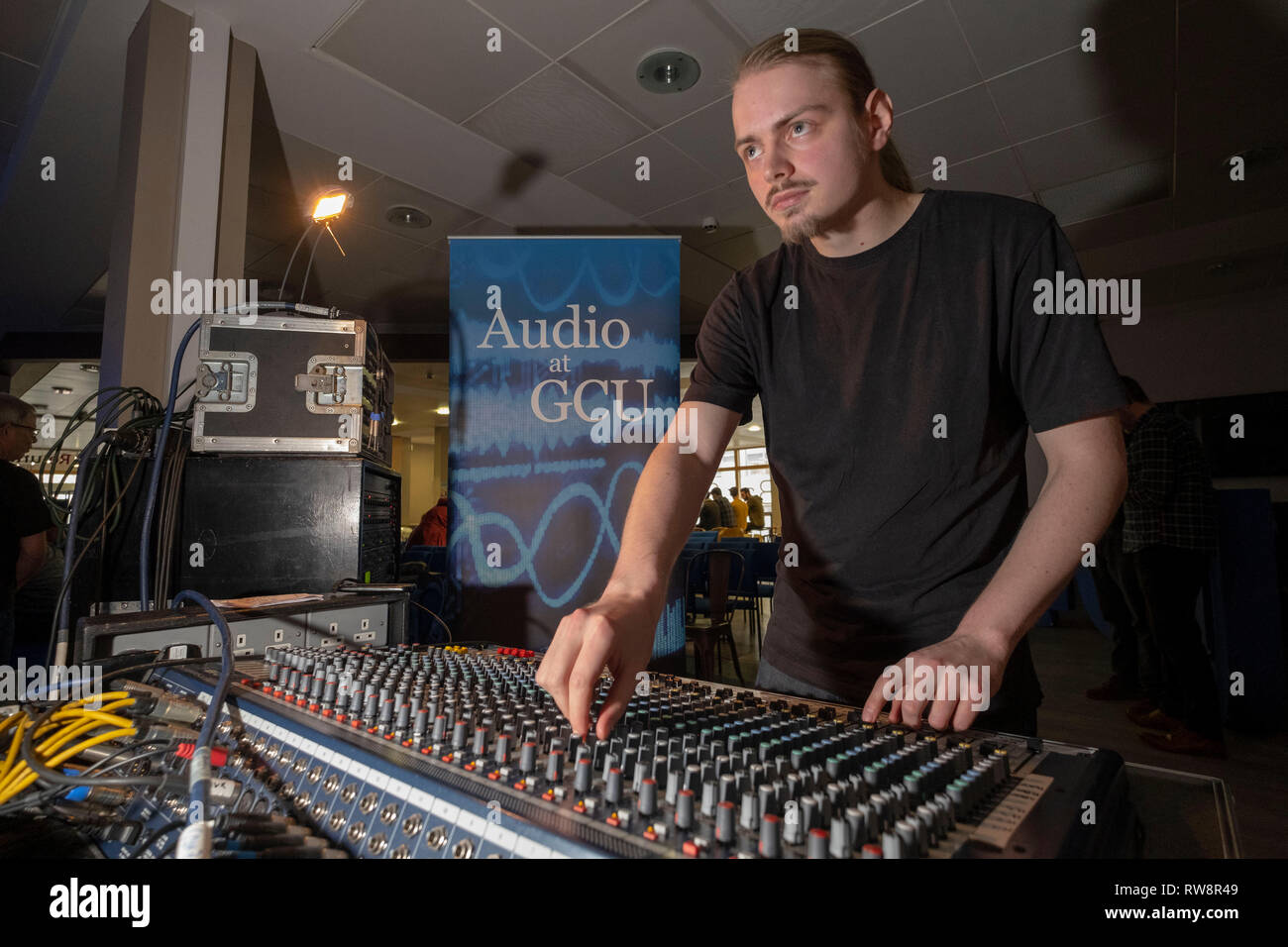 Sound Engineers working at mixing desk Stock Photo Alamy