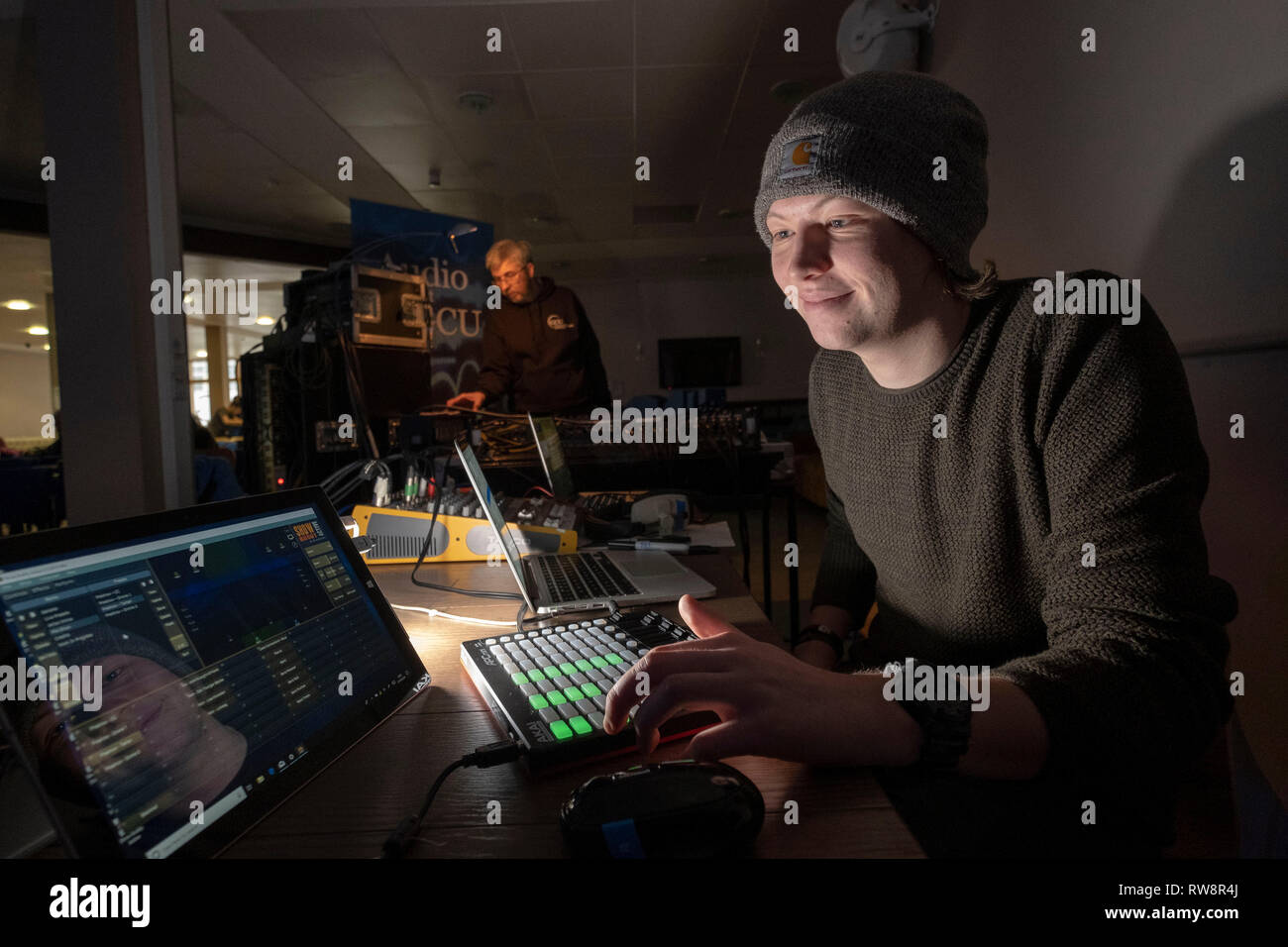 Sound Engineers working at mixing desk Stock Photo Alamy