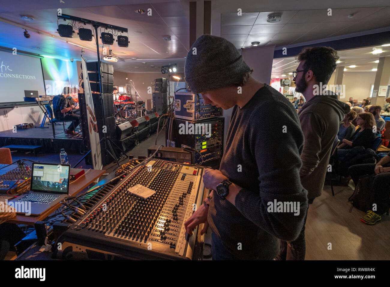 Sound Engineers working at mixing desk Stock Photo Alamy