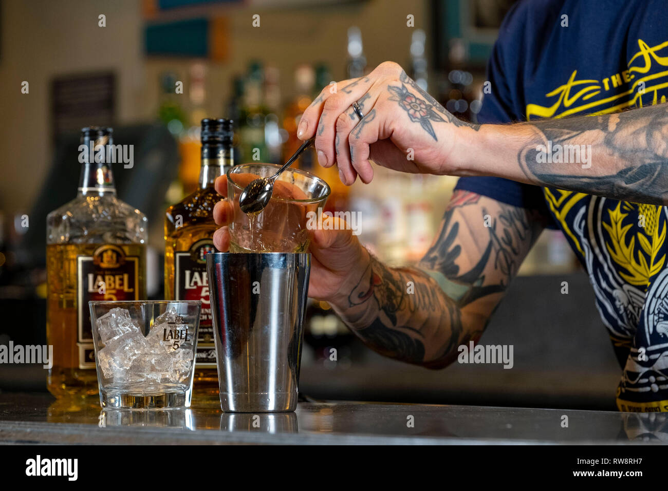 Whisky Cocktail being made by barman Stock Photo Alamy