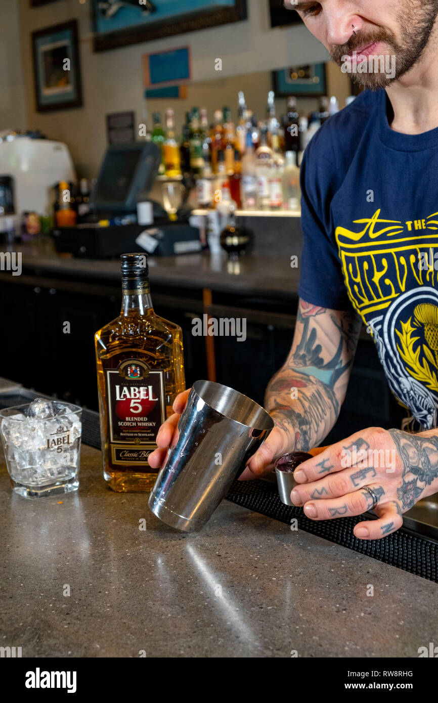 Whisky Cocktail being made by barman Stock Photo Alamy