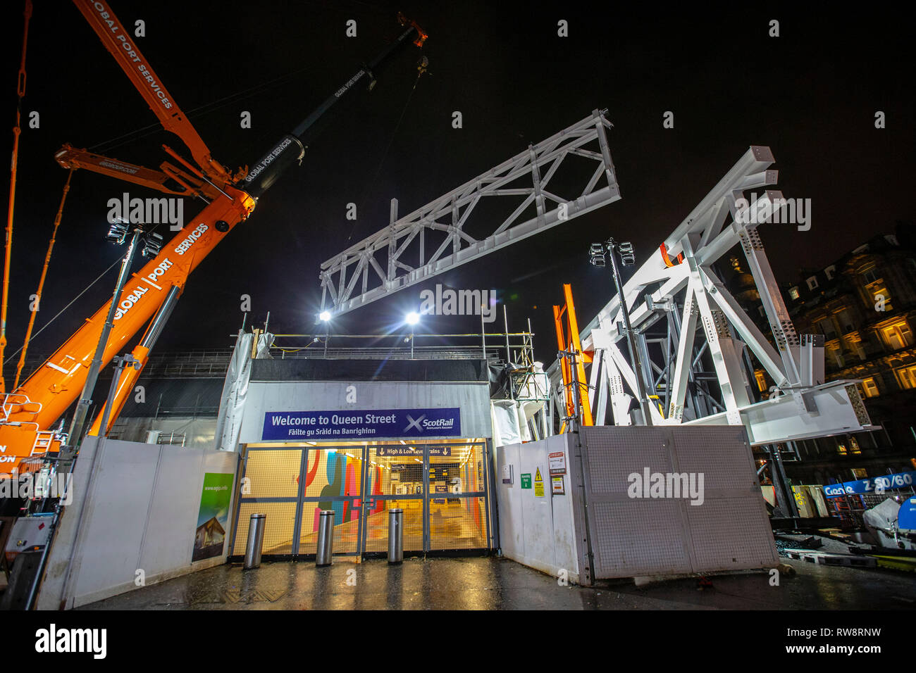 Evening crane lift of major steel work Stock Photo