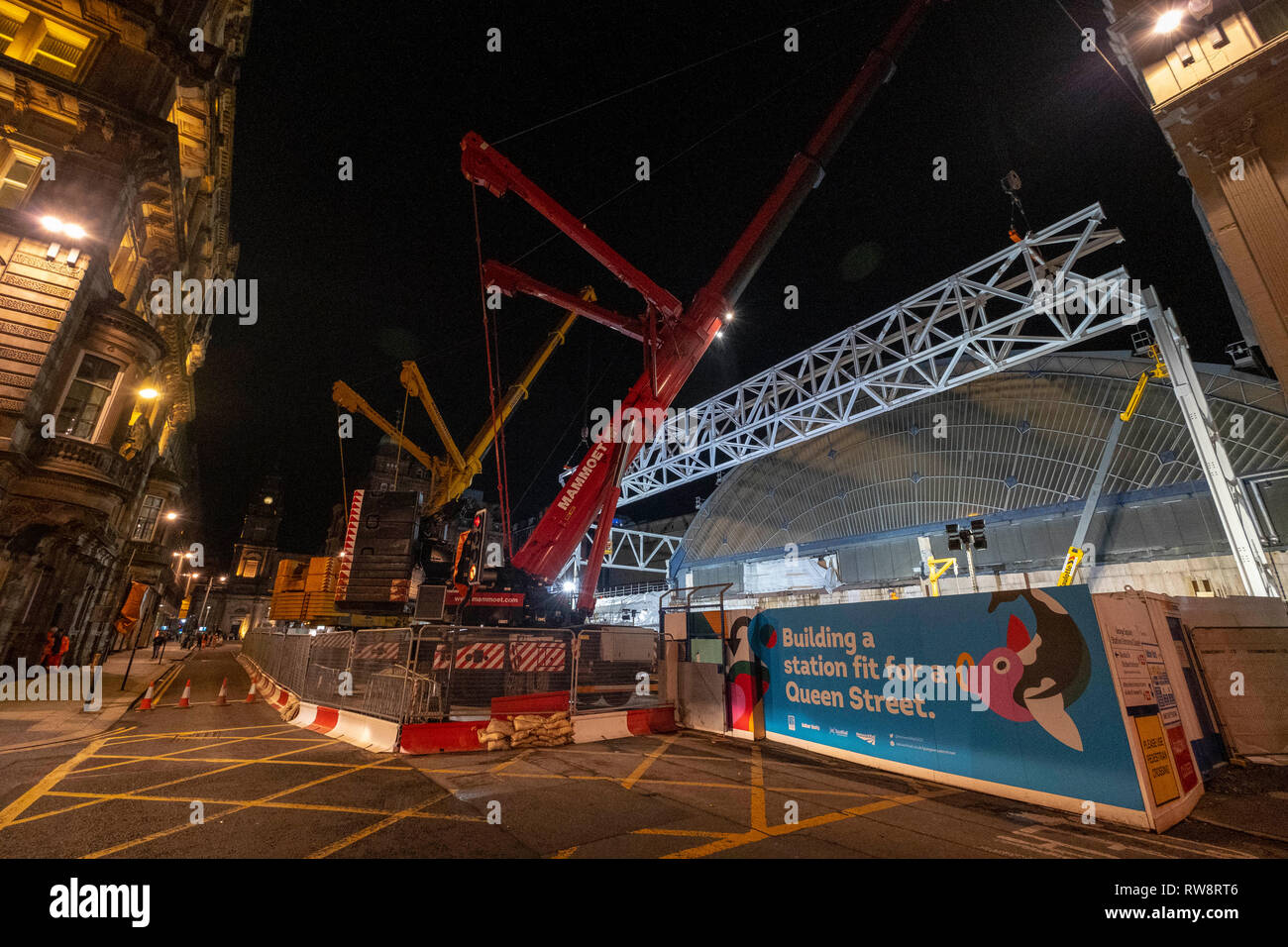 Evening crane lift of major steel work Stock Photo