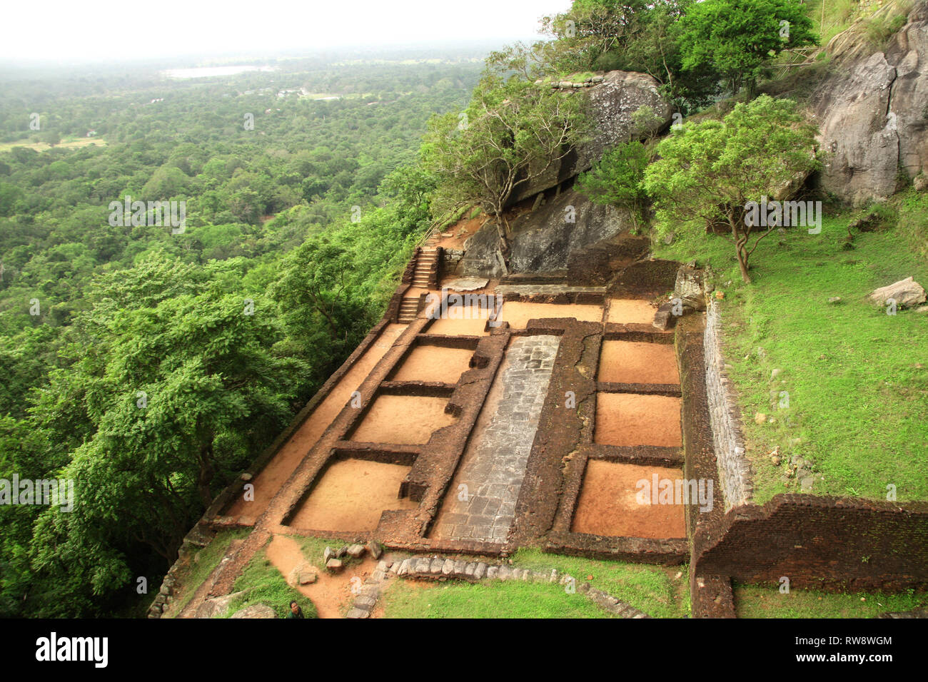 Ruins of fortress and royal palace on top of Sigiriya Rock (Lion Rock) near to Dambulla, Sri Lanka. UNESCO World Heritage Site Stock Photo