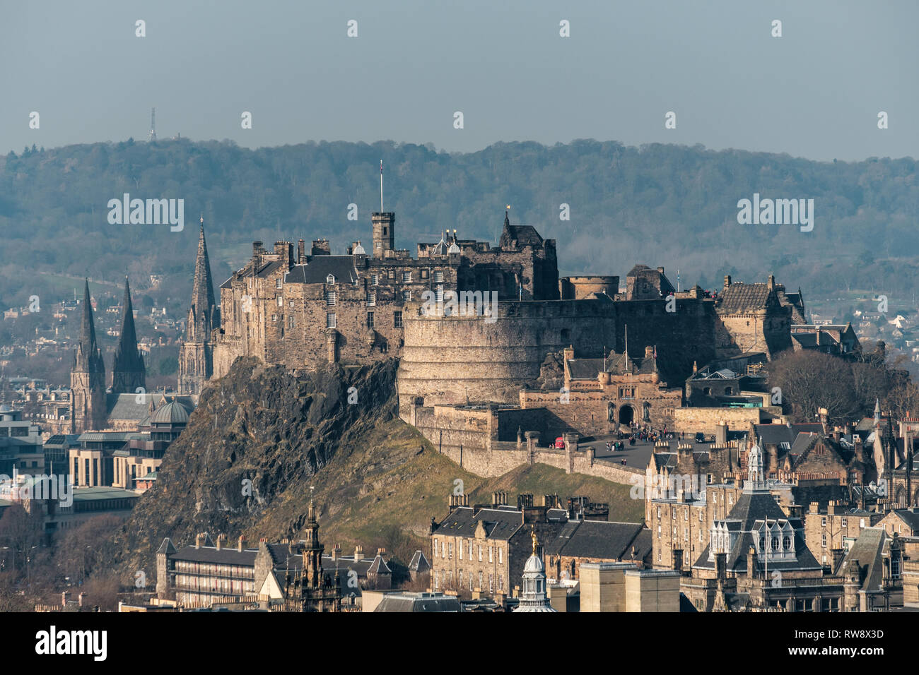 A scenic view of Edinburgh castle and cityscape from Salisbury Crags on a sunny day, Scotland Stock Photo