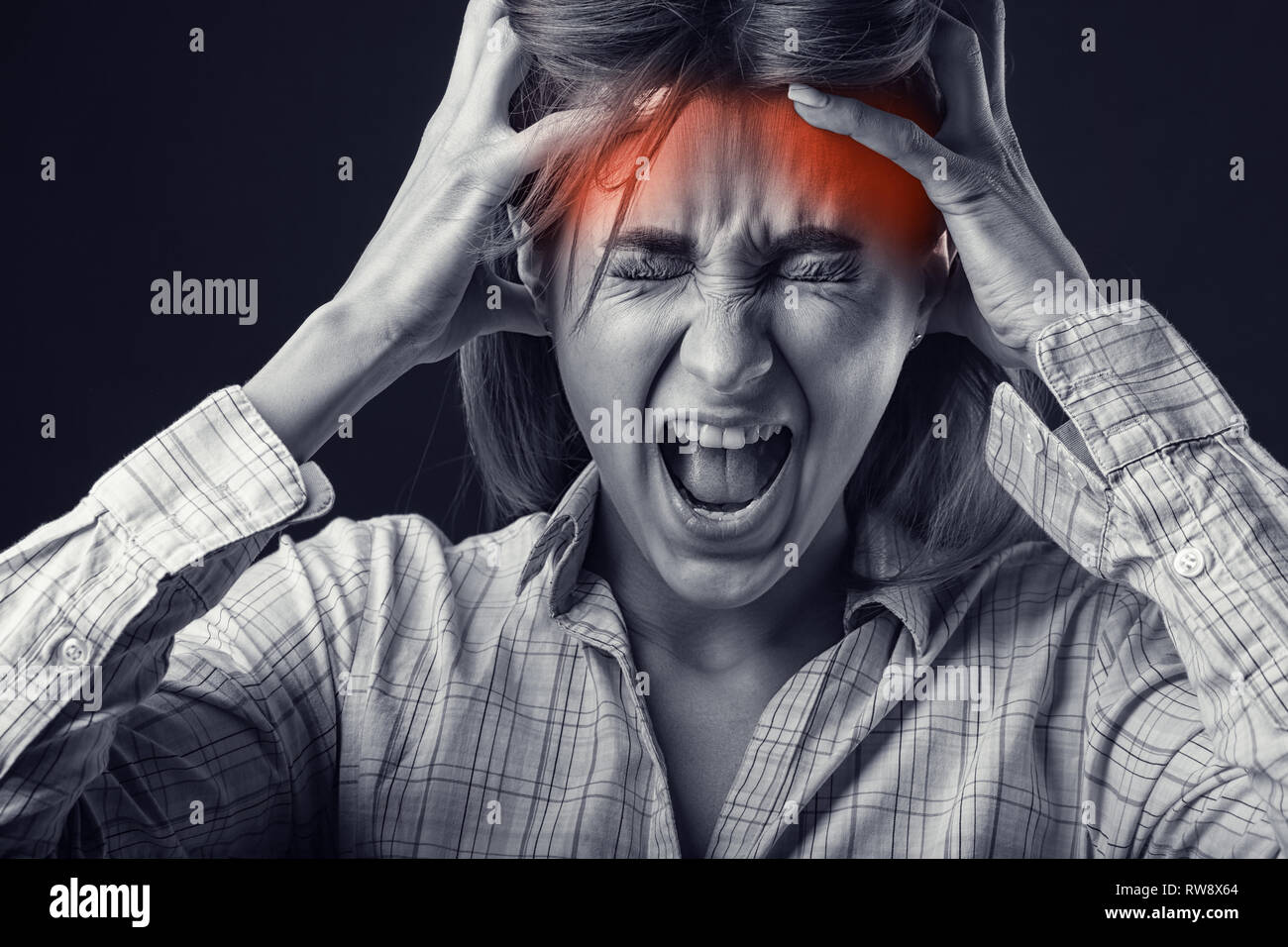 Cry of pain. Woman with headache. Medical concept. Black and white