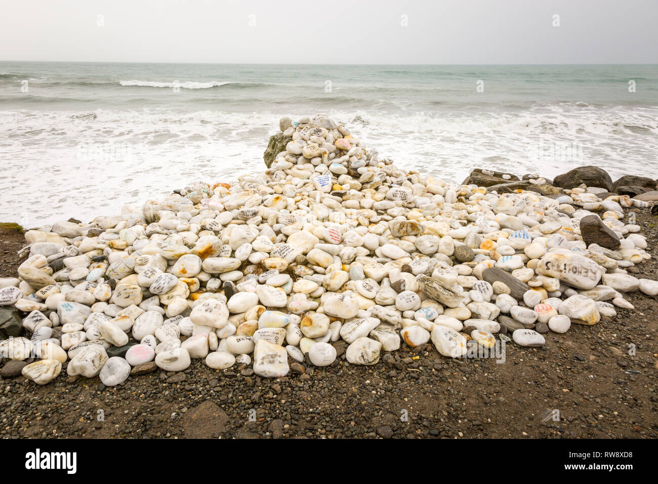 Romantic messages written on white pebbles on a beach, West Coast, New Zealand Stock Photo