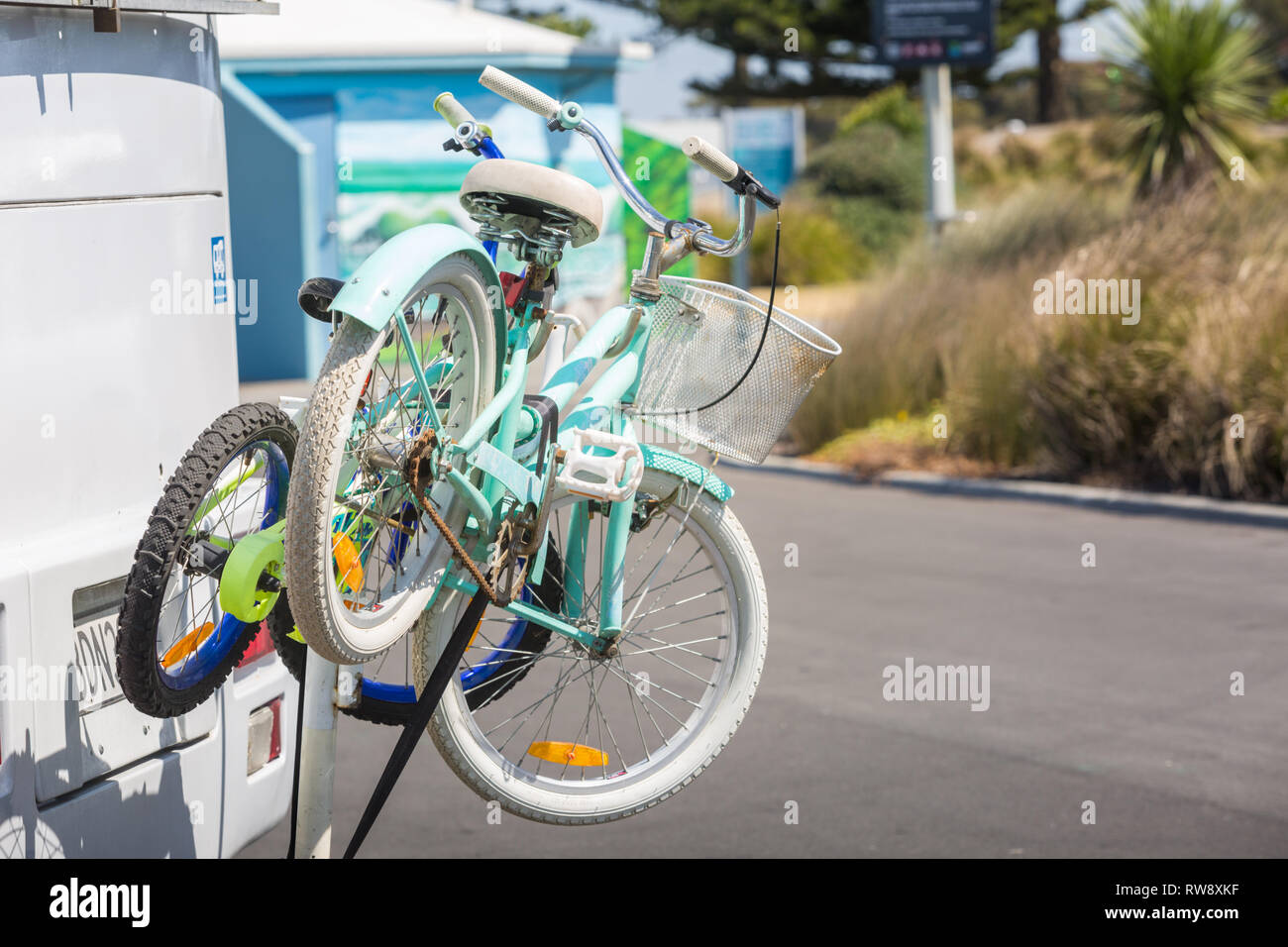 Childrens bicycles mounted on the back of a holiday campervan Stock Photo