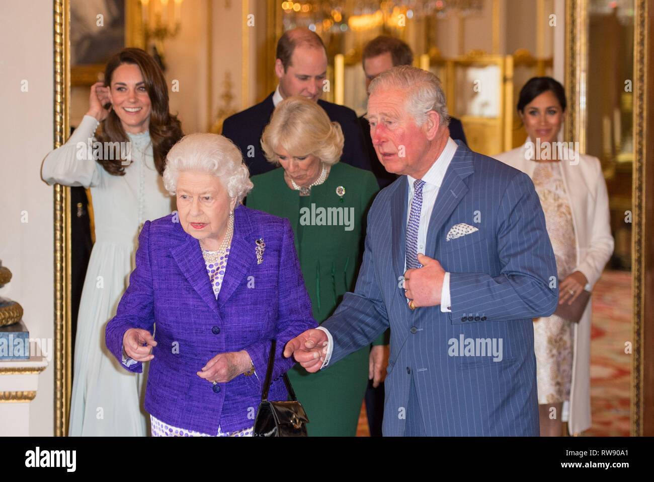 Queen Elizabeth II and the Prince of Wales, followed by the Duke 