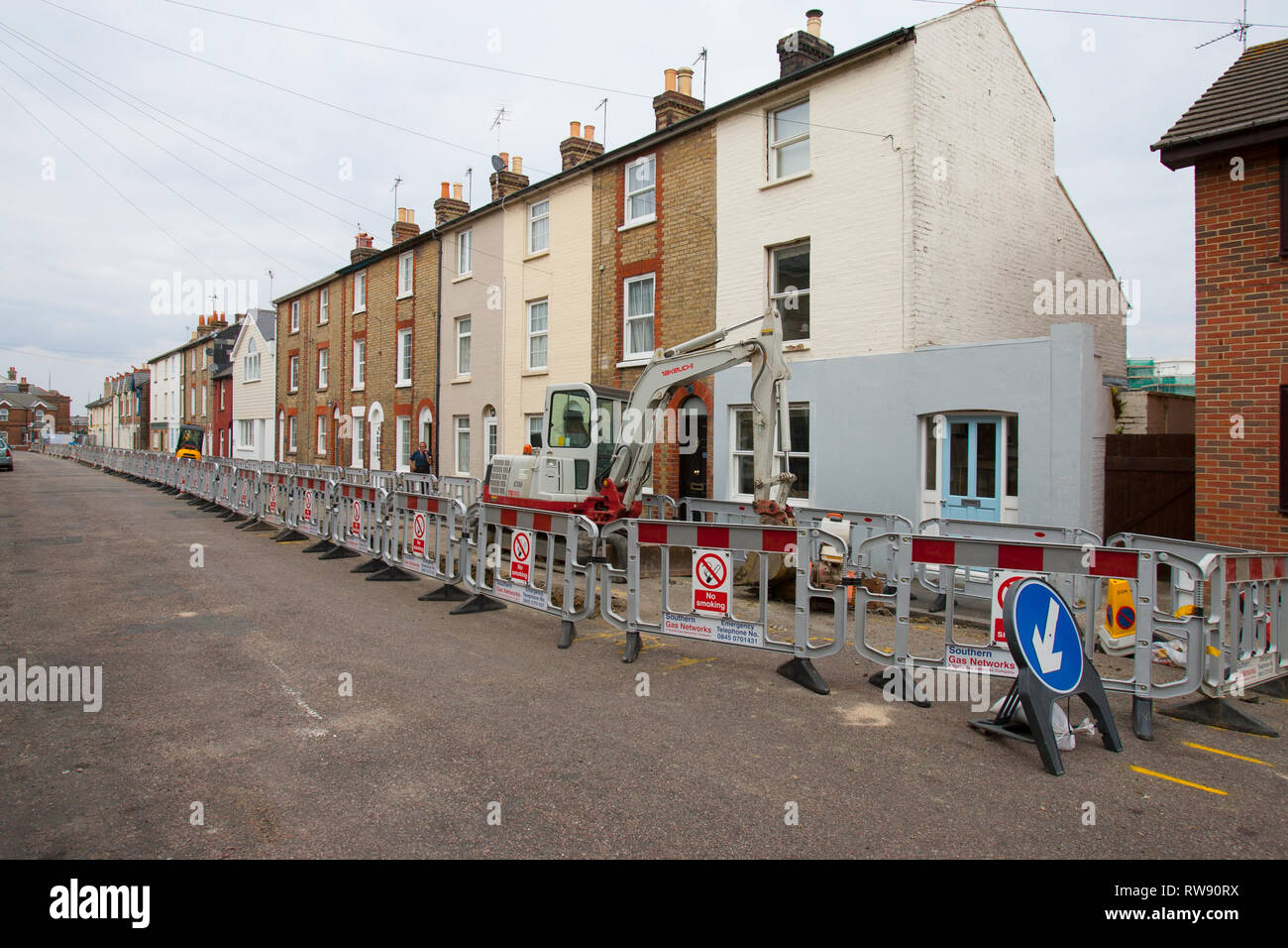 gas, road, works, street, trench, dig, digger, pipes, supply, barrier,  closed, view, above, from, sign, signs, pavement, Stock Photo