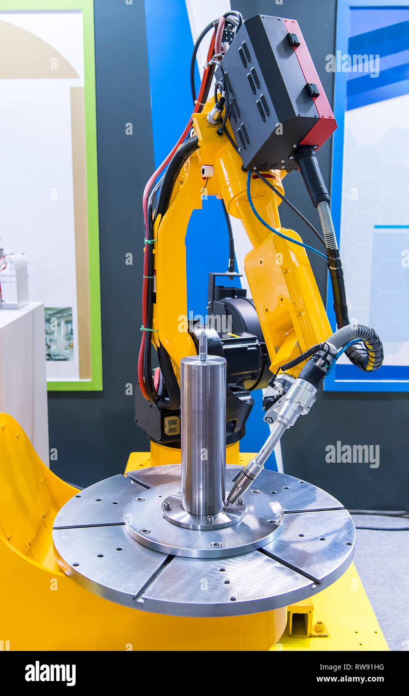 Welding robot in the process Stock Photo